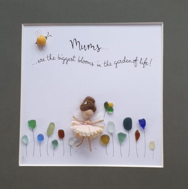 Sea glass picture of a Mor Maids fairy in a sea of wild flowers with a bumblebee maid using a periwinkle shell and the quote 'Mums are the biggest blooms in the garden of life'