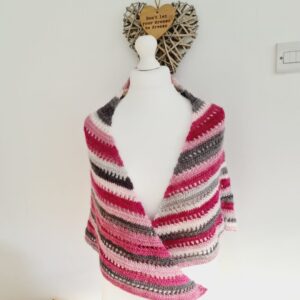 Pink & grey triangle crochet shawl wrap shown on white mannequin.