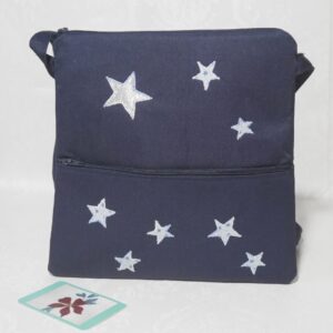 Navy zipped crossbody bag with zipped front pocket and appliqued stars.