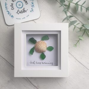 Sea glass and shell turtle picture with the quote Just Keep Swimming