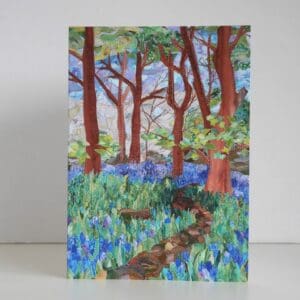 Greetings card showing print taken from textile art picture of wood with bluebells and path through them