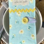 Turquoise blue with white and yellow flowers. Inside is yellow with white circular flowers.