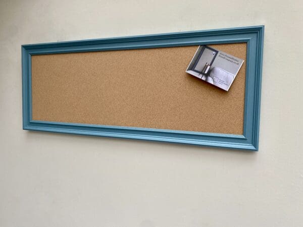 Long blue framed cork pinboard