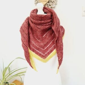 A front view of the mannequin, showing the vibrant colour saturation and the premium finish of the British wool, worn as a neck warmer cowl.