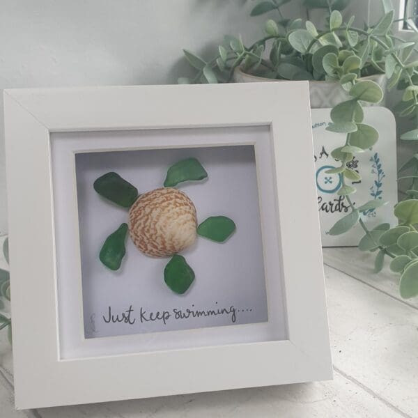 Sea glass and shell turtle picture with the quote Just Keep Swimming
