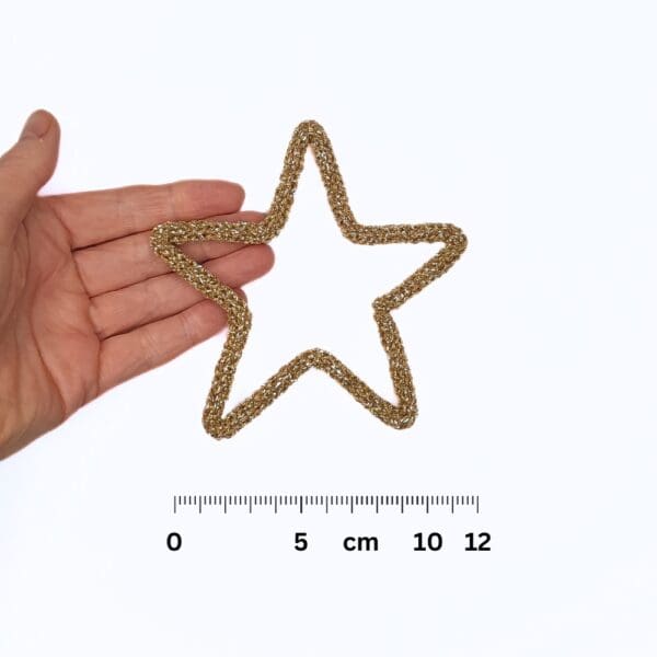 Knitted wire Christmas decoration featuring a gold star