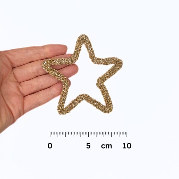 Knitted wire Christmas decoration featuring a gold star