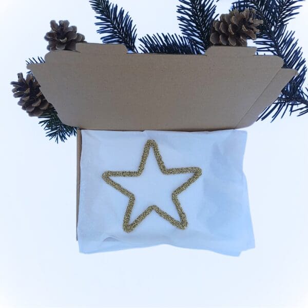 Knitted wire Christmas decoration featuring a gold star