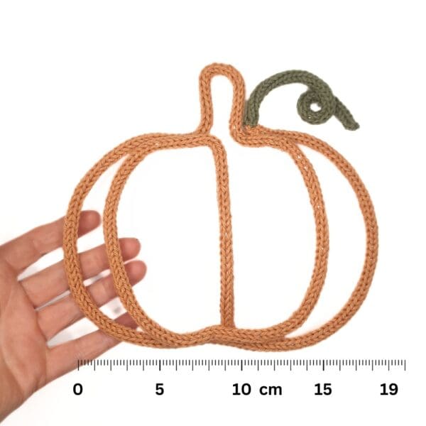 Knitted wire Halloween decoration featuring a pumpkin.