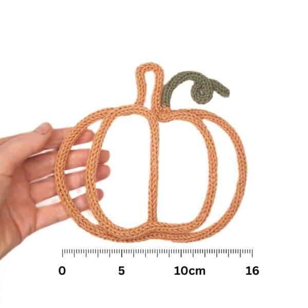 Knitted wire Halloween decoration featuring a pumpkin.