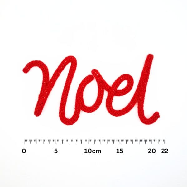 Knitted wire Christmas decoration with the word 'Noel'