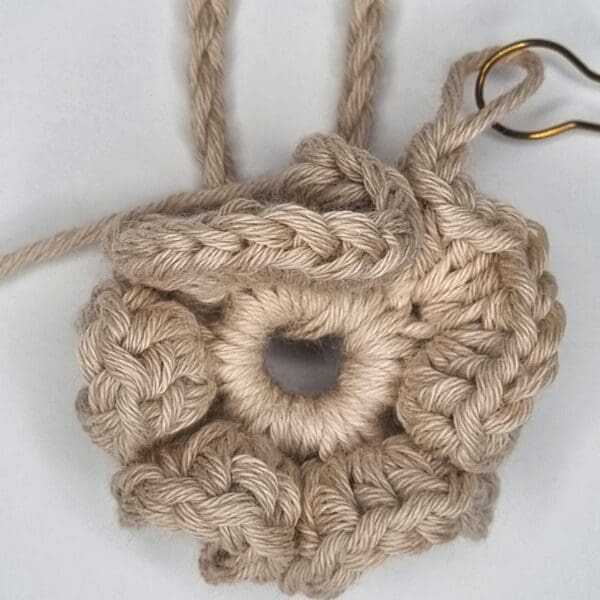 unfinished crochet shower puff in beige