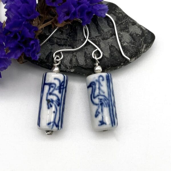 earrings made from upcycled blue and white patterned beads from a vintage necklace mounted in silver on silver ear wires