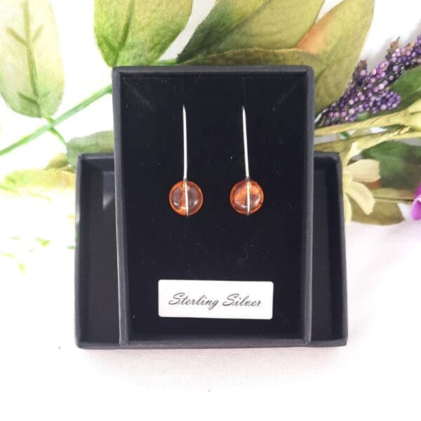 Sterling silver drop earrings with amber.