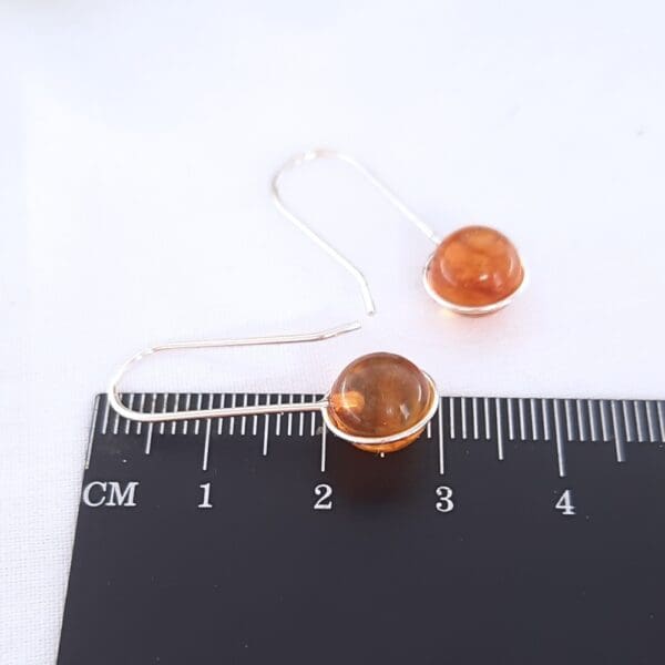 Sterling silver drop earrings with amber.