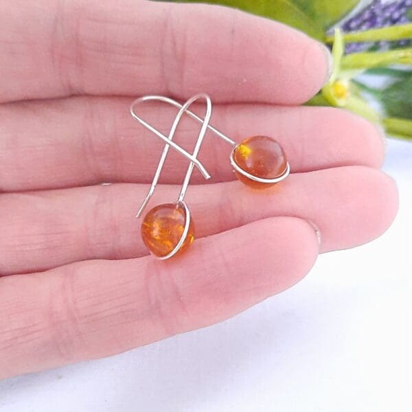 Sterling silver drop earrings with amber.