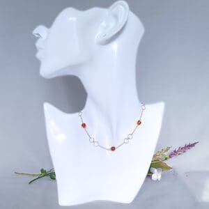 Sterling silver necklace with large circular links and amber beads in a Halo fitting.