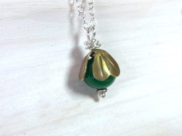 Green Jade Bead Pendant with Brass Cap on a Silver Chain - Image 6