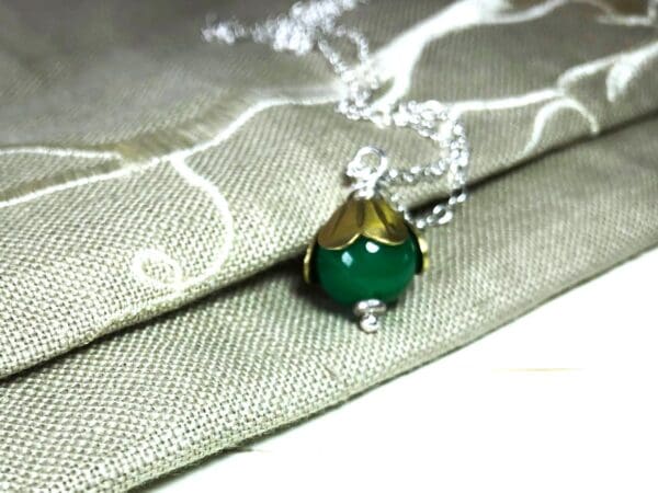 Green Jade Bead Pendant with Brass Cap on a Silver Chain - Image 2