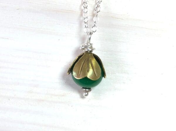 Green Jade Bead Pendant with Brass Cap on a Silver Chain - Image 5