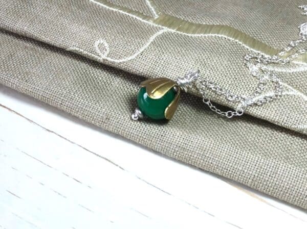 Green Jade Bead Pendant with Brass Cap on a Silver Chain - Image 3