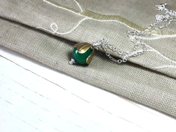 Green Jade Bead Pendant with Brass Cap on a Silver Chain - Image 4