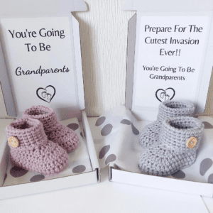 pregnancy reveal announcement idea for grandparents, which include a pair of newborn baby booties.