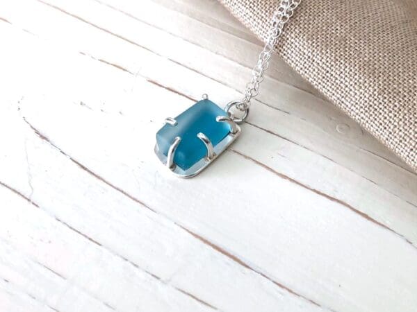 Blue Pendant set in Silver with a Sea Glass Style Surface Texture