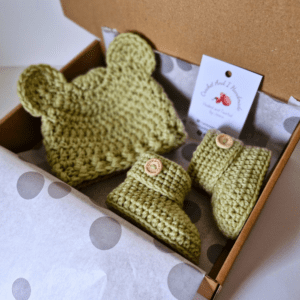 handmade crochet teddy bear hat and matching booties, pictured in shade mushy peas, the set comes in sizes newborn to 6 months with a variety of colours to choose from - it's a perfect baby shower gift by Crochet And I Handmade