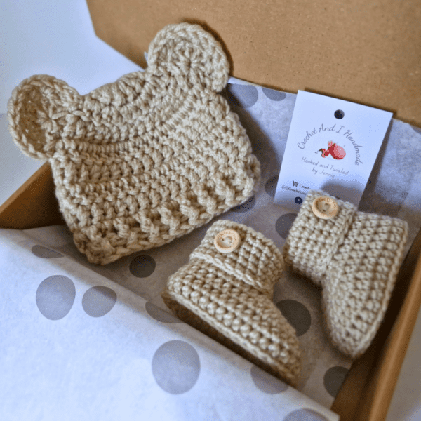 an adorable handmade baby set including a pair of baby booties and a teddy beanie hat - the perfect gift for a newborn