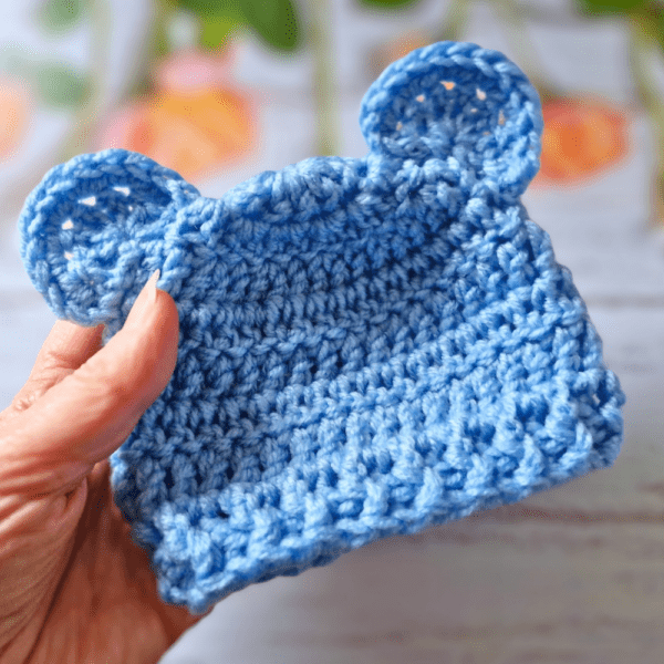 adorable handmade teddy bear beanie hat with a ribbed edging to keep it snug around babies head