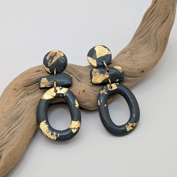 Gold leaf statement earrings in dark sage