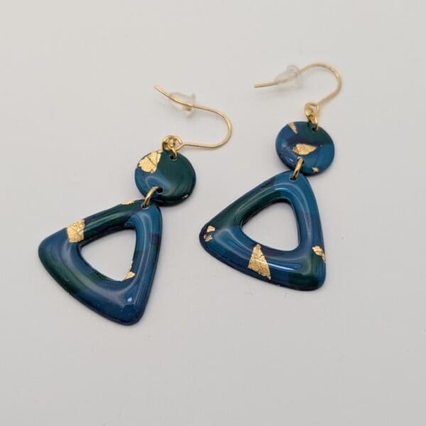 Gold leaf triangle statement earrings in ocean greens.