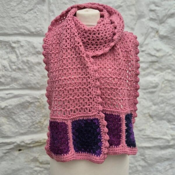 crocheted wrap in pinks