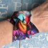 Colourful fabric cuff in a tropical theme with a twisted front.