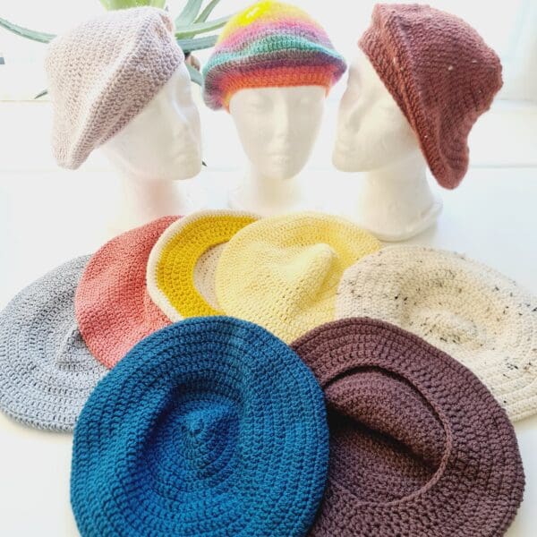 Group photo showing the various colours of the crochet beret hat by Sarah Lou Crafts.