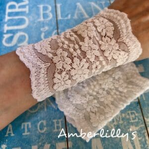 White cuffs one pair with floral design shown against a blue background