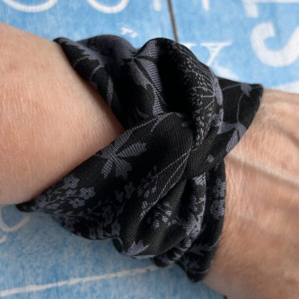 Wide wrist cuff covering in black with flower design - Image 2