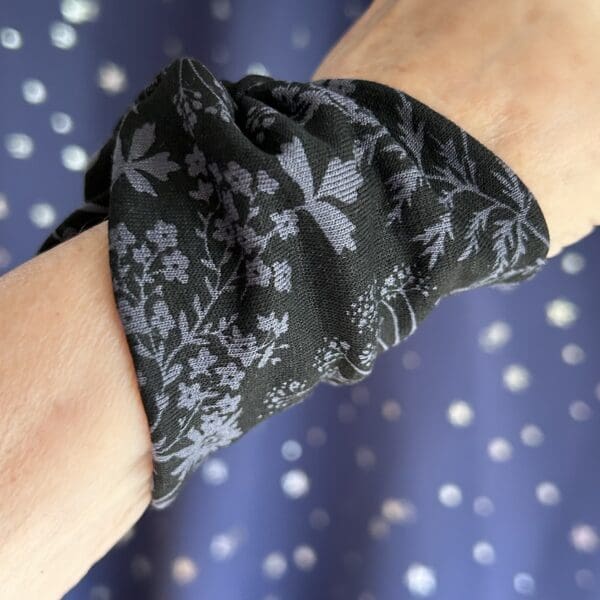 Wide wrist cuff covering in black with flower design - Image 3