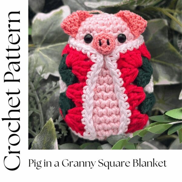picture shows a crochey pig wrapped in a granny square blanket. The blanket is red, white and green and the pig is pale pink. There are the words Crochet Pattern written along the bottom of the image