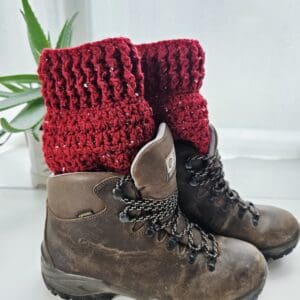 Chilli Red aran yarn crochet boot cuffs, styled with brown hiking boots.
