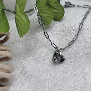 Paper clip chain bracelet with a heart and a diamanté charms..bracelet is stainless steel